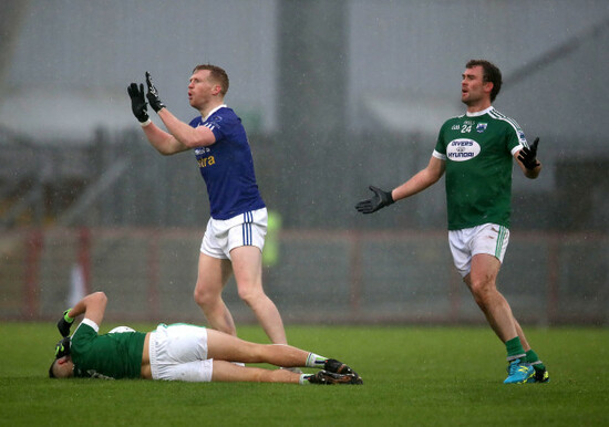 Kieran Hughes appeals to the referee after a foul on Ordhran McFadden Ferry