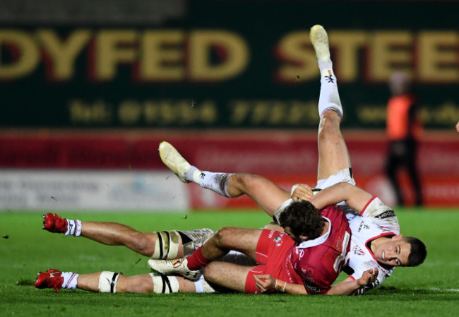 Tom Prydie is tackled by James Hume