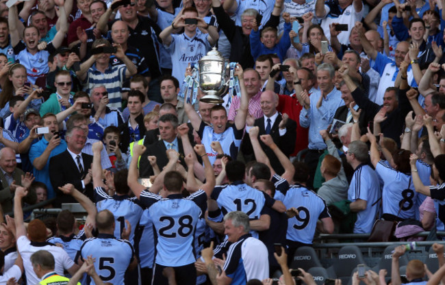 Johnny McCaffrey lifts the Bob O'Keeffe cup