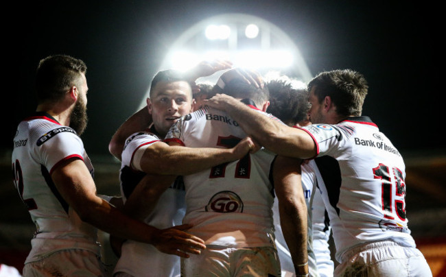 Jacob Stockdale celebrates scoring a try with teammates