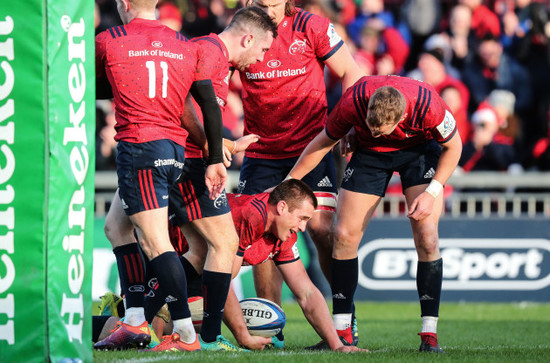 CJ Stander celebrates scoring his sides second try with JJ Hanrahan and Mike Haley