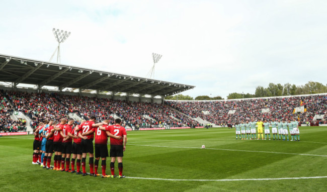 The teams observe a minute's silence