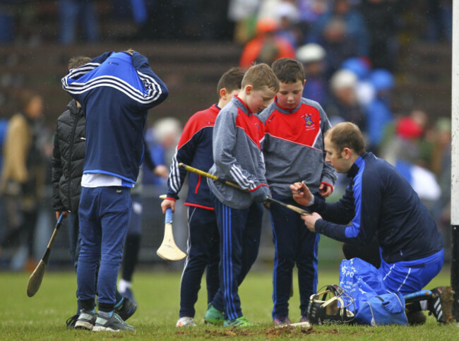 Waterford's Ian O'Regan stops to sign autographs for fans at the end of the game