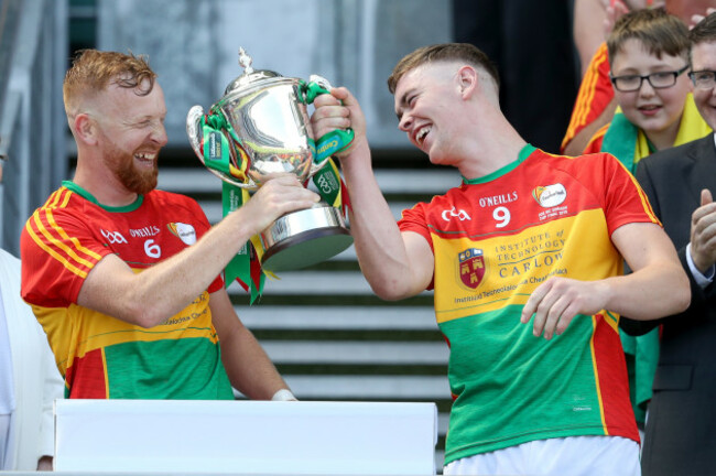 Richard Coady lifts the trophy with Diarmuid Byrne