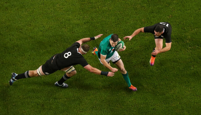 Johnny Sexton with Ryan Crotty and Kieran Read