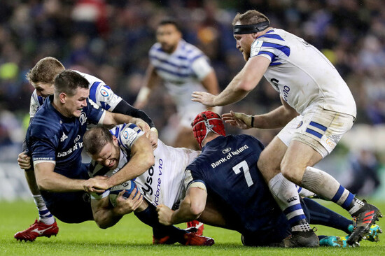 Jamie Roberts tackled by Johnny Sexton and Josh van der Flier