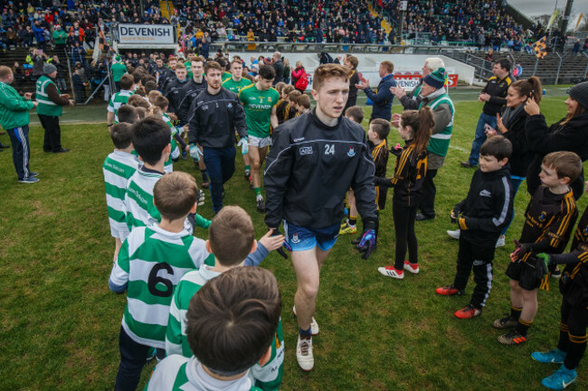 Paddy Small makes his way through the guard of honour