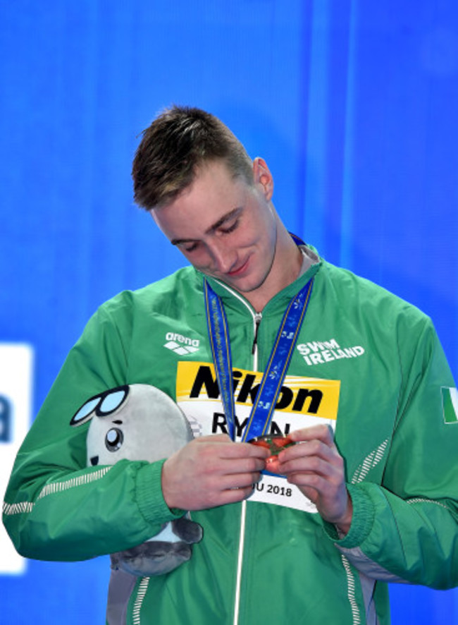 Shane Ryan celebrates with his bronze medal