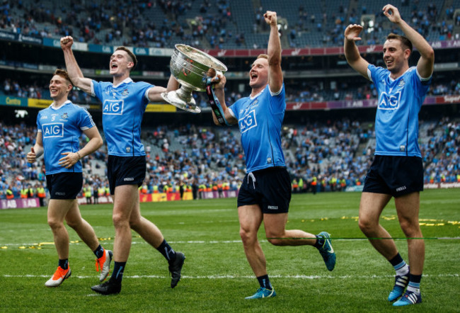 John Small, Brian Fenton, Ciaran Kilkenny and Cormac Costello celebrates after the game with the trophy