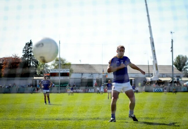 Brian Kavanagh looks on as his penalty hits the woodwork