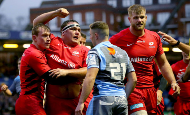 Jamie George celebrates scoring a try