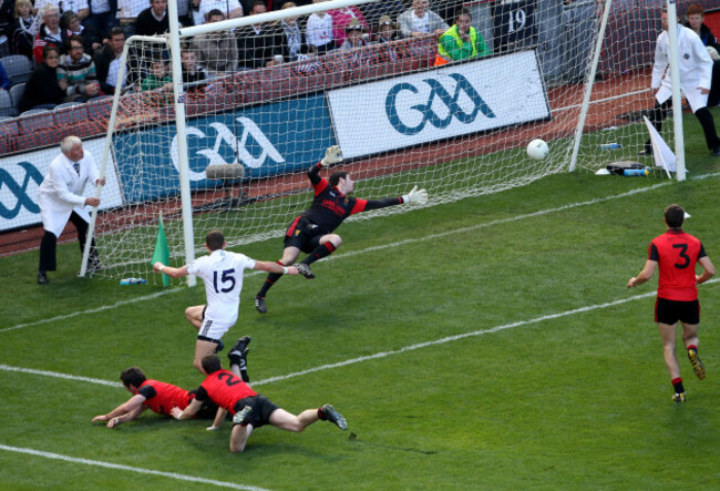 Eamonn Callaghan shoots past goalkeeper Brendan McVeigh