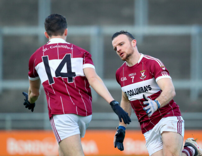 Donal McElligott celebrates a point with Rian Brady