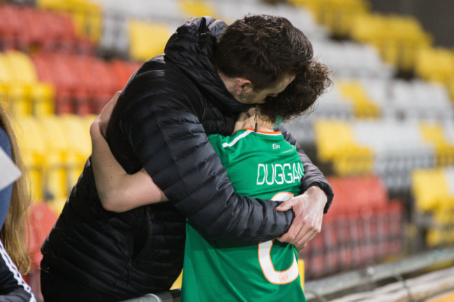 A dejected Karen Duggan is comforted at the end of the game