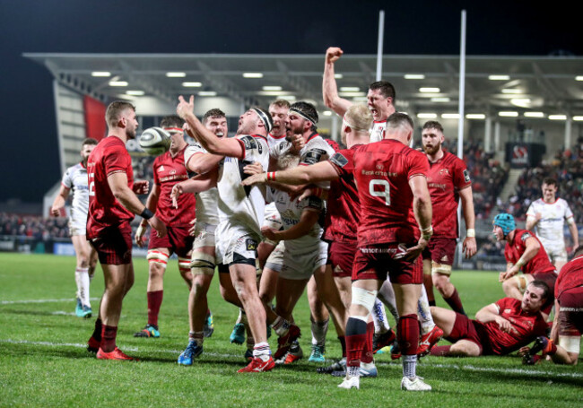 Rob Herring celebrates scoring a try with teammates