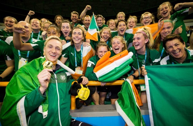 Shane Ryan celebrates winning with the Irish athletes and staff