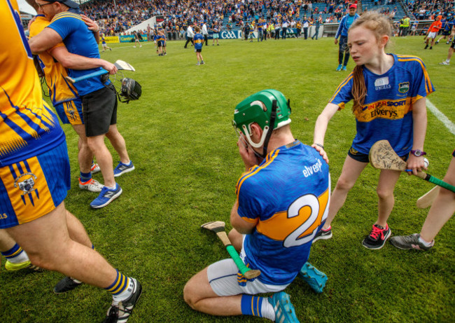 A young fan consoles Noel McGrath