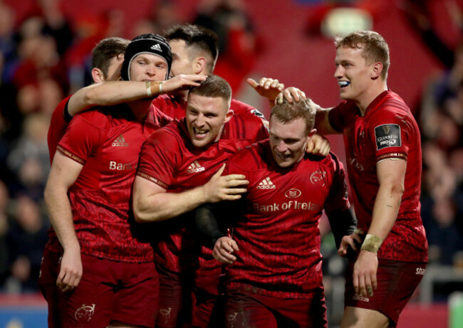 Keith Earls celebrates after scoring a try with Andrew Conway, Tyler Bleyendaa and Mike Haley