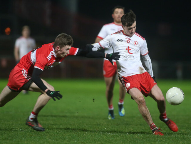 Darragh Canavan scores a point despite Paul McNeill