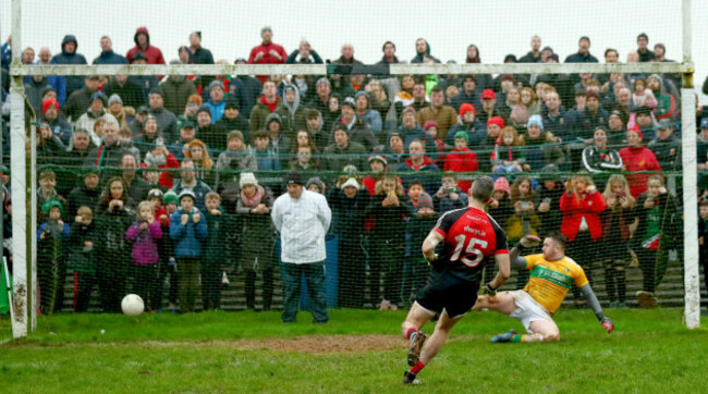 Evan Regan scores the winning penalty past goalkeeper Diarmuid McKiernan