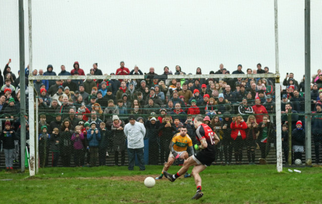 Evan Regan scores the winning penalty past goalkeeper Diarmuid McKiernan