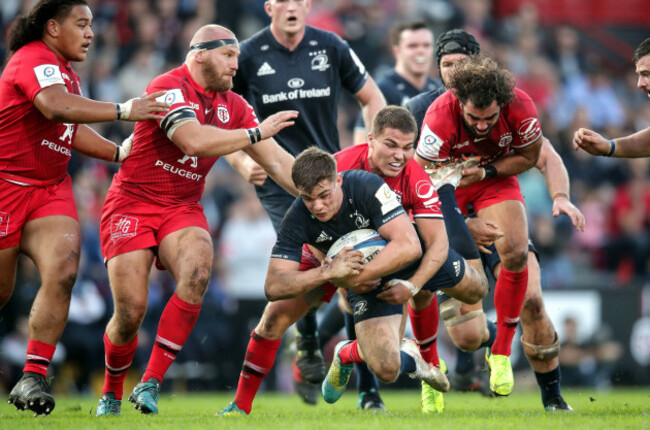 Garry Ringrose tackled by Antoine Dupont and Yoann Huget