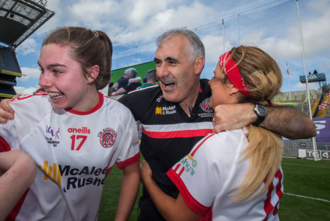 Gerry Moane celebrates with Maria Canavan and Lycrecia Quinn after the game