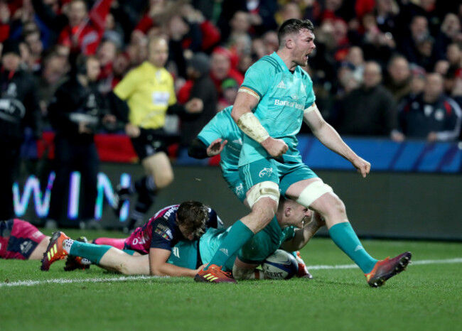 Keith Earls and Peter O'Mahony celebrate as Rory Scannell scores their second try