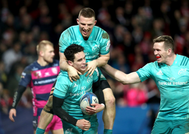 Joey Carbery celebrates scoring his second try with Andrew Conway and Chris Farrell