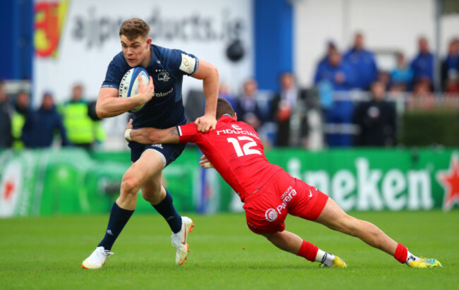 Garry Ringrose is tackled by Romain Ntamack