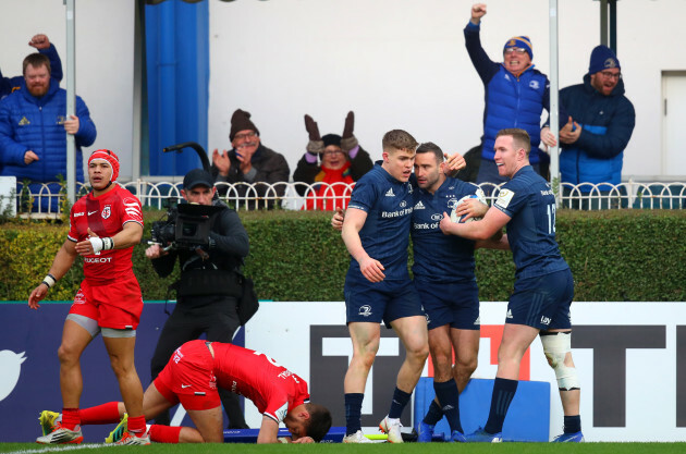 Dave Kearney celebrates his try with Garry Ringrose and Rory O'Loughlin