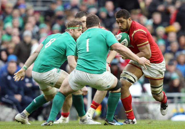 Taulupe Faletau charges at Jamie Heaslip and Jack McGrath