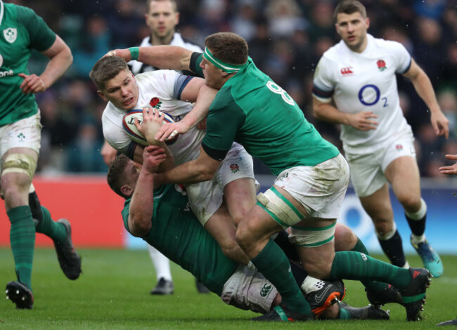 Owen Farrell is tackled by Tadhg Furlong and CJ Stander
