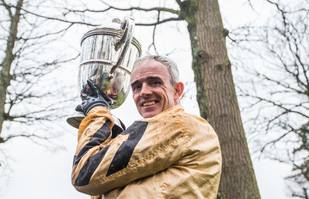 Ruby Walsh is presented with the trophy after winning with Invitation Only