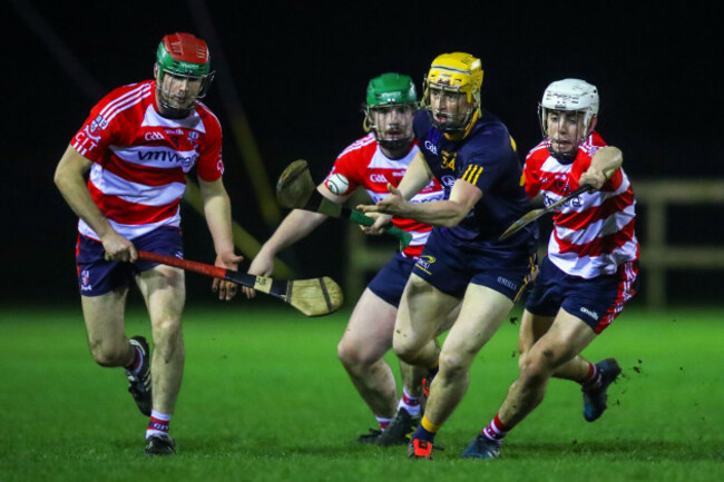 Damien Reck is tackled by Eoin O'Shea