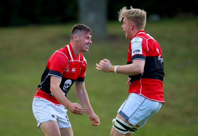 James Taylor celebrates scoring a try with Mark Bissesar