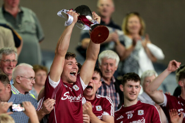 Fintan Burke lifts the trophy