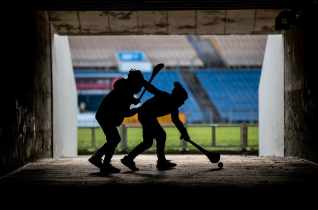 Two young Waterford fans puck around in the tunnels under Semple Stadium before the game