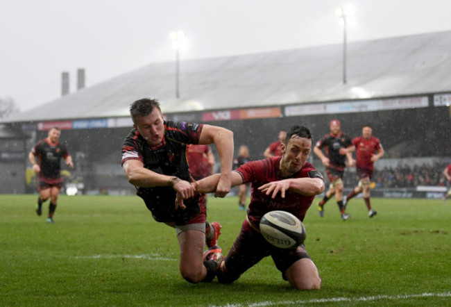 Darren Sweetnam attempts to beat Will Talbot-Davies to the ball