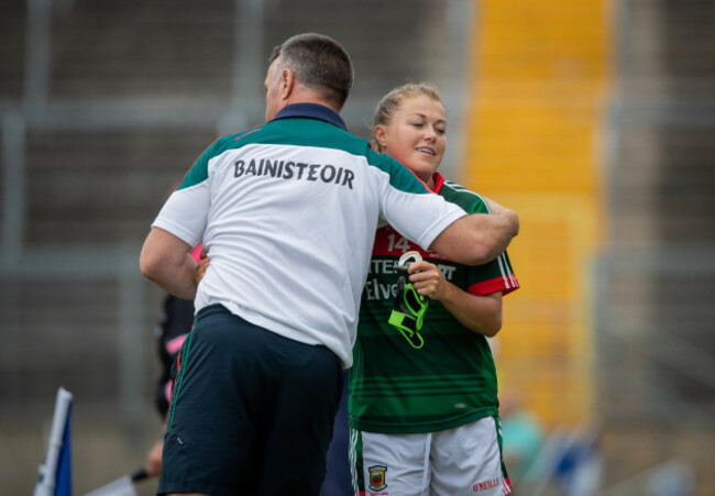 Peter Leahy hugs Sarah Rowe as she comes off the pitch