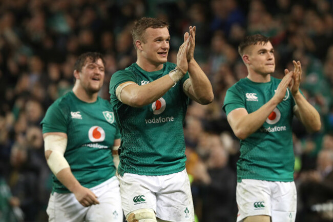 Andrew Porter, Josh van der Flier and Garry Ringrose celebrate after the game