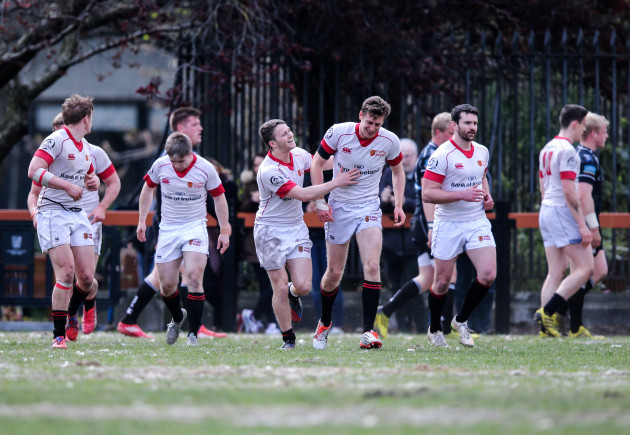 Conor Kearns celebrate scoring a try with teammates
