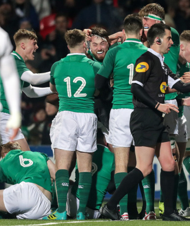 Thomas Clarkson celebrates scoring a try with teammates