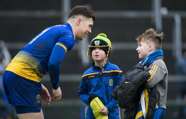 Darren O'Malley with young fans after the game