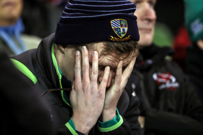 An Ireland fan dejected late in the game