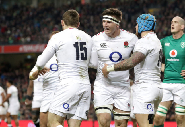 Elliot Daly celebrates his try with Tom Curry and Jack Nowell