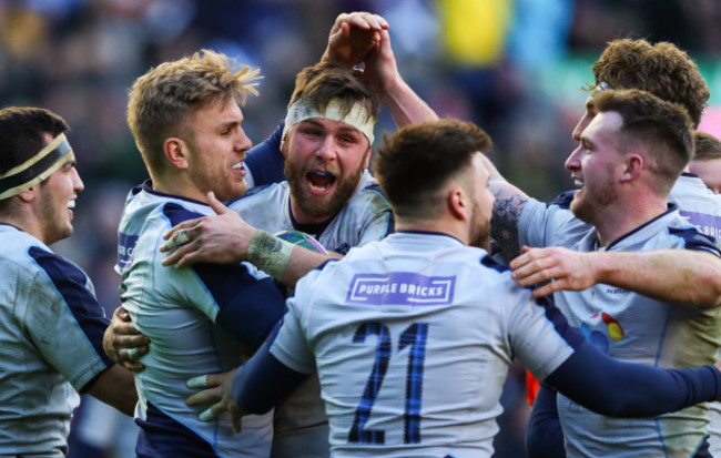 Chris Harries celebrates scoring their fifth try with teammates