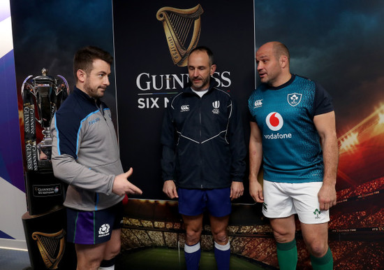 Greig Laidlaw and Rory Best with Romain Poite at the coin toss