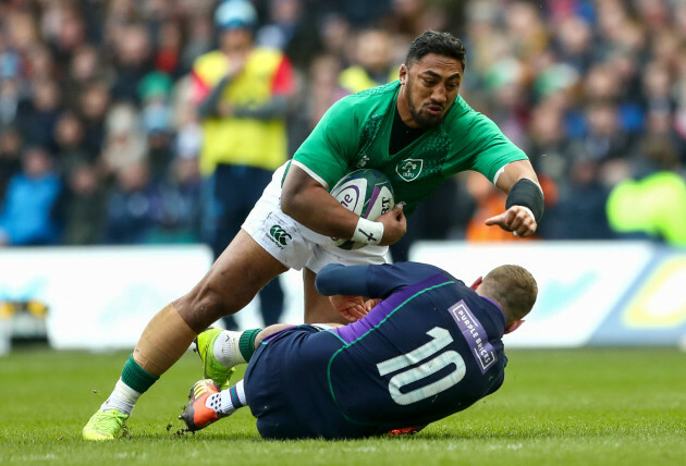 Bundee Aki is tackled by Finn Russell