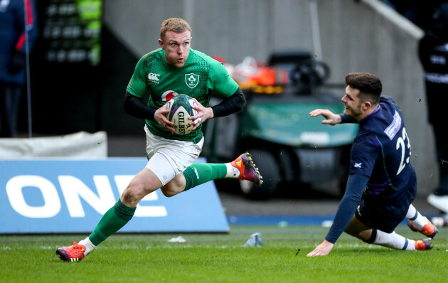 Keith Earls scores their third try despite Blair Kinghorn